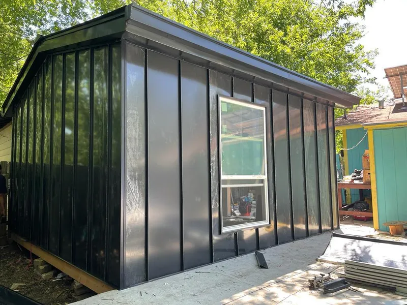 Black standing seam metal wall panels for Roof Inspection in Alexandria